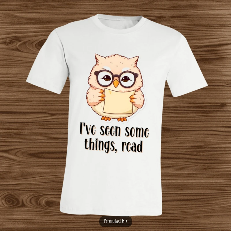 Funny owl t-shirt with tiny reading glasses, holding a scroll with a slight smirk, ideal for book lovers.
